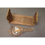 Late 19th / Early 20th century Oak Bookslide heavily carved and pierced with leaves together with