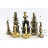 Five vintage lamp bases and a pair of brass candlesticks