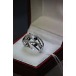 A 14ct white gold ring set with blue and white sapphires