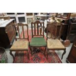 Pair of French Oak Carved Dining Chairs with String Seats together with a similar French Oak