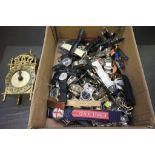 A box of watches along with a clock