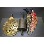 Two vintage Daggers, a meat rotator and an Islamic brass rotating dial possibly for Astrology