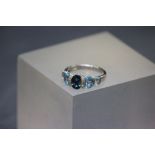 A 14ct white gold blue topaz and diamond ring