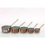 Set of Five Small Copper Graduating Saucepans with Brass Handles