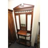 Late Victorian Mahogany Hall Cloak / Stick Stand with central mirror flanked by coat hooks above a