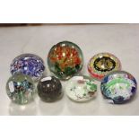 Seven Glass Paperweights including Lizard example