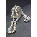 A long necklace of baroque pearls
