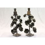 Unusual pair of metal candlesticks with a floral theme