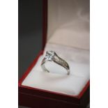 A 14ct white gold aquamarine and diamond ring