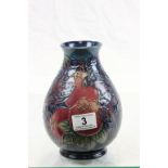 Bulbous Moorcroft vase depicting Birds eating Fruit