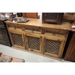 Hardwood Sideboard with Three Long Drawers over three fretwork panel doors