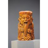 Bone netsuke of a wise man with gold