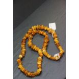 A Baltic egg yolk amber long necklace