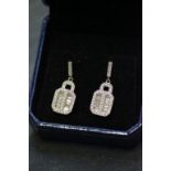 A pair of silver and CZ panelled earrings