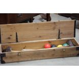 A boxed croquet set with hoops mallets and balls.
