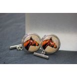 A pair of silver cufflinks with enamel image of a horse