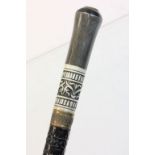 An ebonised sword stick with bone inlay.