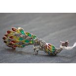 An impressive silver plique a jour peacock brooch