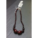 Cherry amber bakelite graduating bead necklace