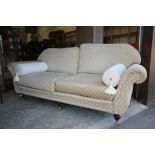 Steed Upholstery Two Seater Sofa, cream and green upholstered fabric, raised on wooden legs and