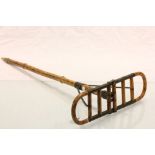 An early 20th century bamboo and metal mounted shooting stick.