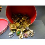 Pink hatbox with approximately 100 vintage & modern brooches