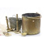 Brass coal bucket with Coat of Arms to the side and containing vintage horse brasses