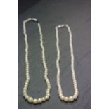 Two vintage Pearl necklaces in a vintage necklace box
