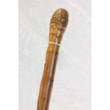 Bamboo walking stick carved with a snake and rat