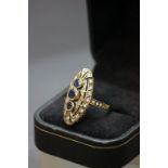 A 9ct yellow gold sapphire and diamond art deco style ring