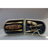 A vintage leather cased manicure set.