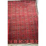 Two Eastern Wool Red Ground Rugs and Red Rum Rug