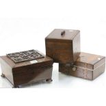 An antique rosewood box raised on bun feet a mahogany writing slope and an oak box.