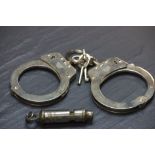 Military police issue handcuffs and whistle