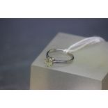 An 18ct white gold single stone diamond ring of 75 points