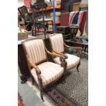 Pair of Continental Mahogany Elbow Chairs, with upholstered backs and seats and carved scroll arms