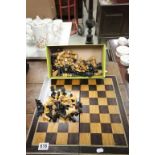 Vintage folding Rosewood chessboard and a box of vintage wooden Chess pieces