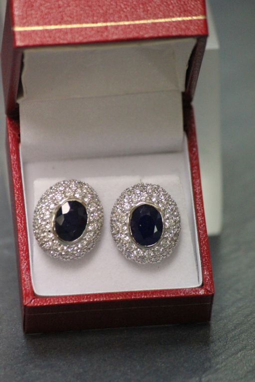 A pair of silver CZ and substantial sapphire earrings