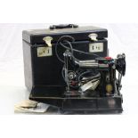 Cased Singer sewing machine model 222k and accessories