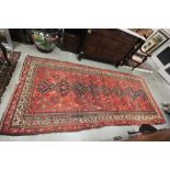 Eastern Red Ground Rug with Geometric Patterns