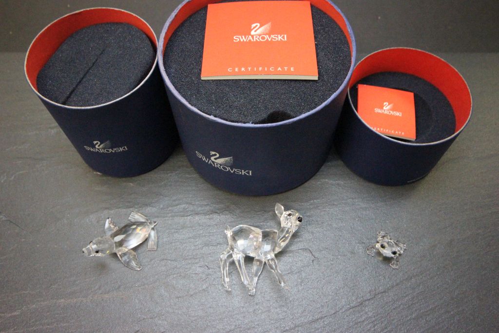Three boxed Swarovski items to include 235045 Standing Fawn, 221120 Baby Sea Lion, 286313 Baby Frog