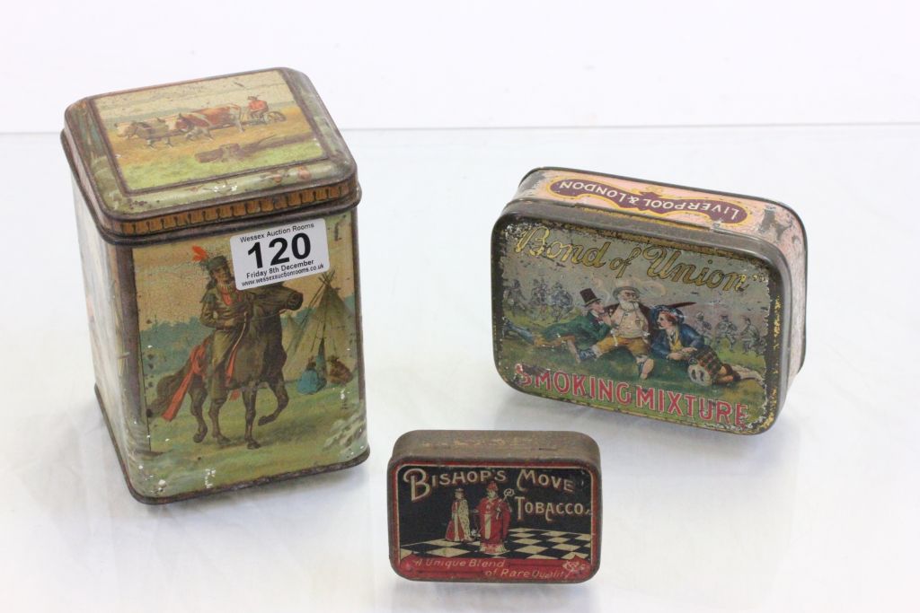 Three vintage tins, one with a colonial scene