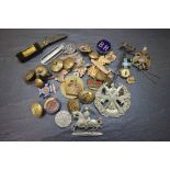 Small wooden box of Military badges and buttons