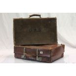 A vintage leather suitcase and one other .