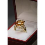 A 10ct yellow gold substantial citrine and diamond ring