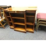 Regency style Yew wood break front bookcase, 12" deep, 4' long graduating shelves enclosed