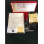 Gent's Omega 9xct gold wrist watch on leather strap with original receipt, papers and box, the