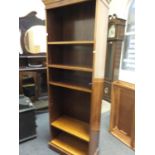 Regency style Yew wood open bookcase with graduating shelves enclosed