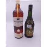 Litre bottle of Grande Cuvee Mandarine Napoleon liquer, and a70cl bottle of brandy by Coitisolo