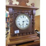 Oak mantle clock with an 8 day ansonia movement striking on a gong est 20-50